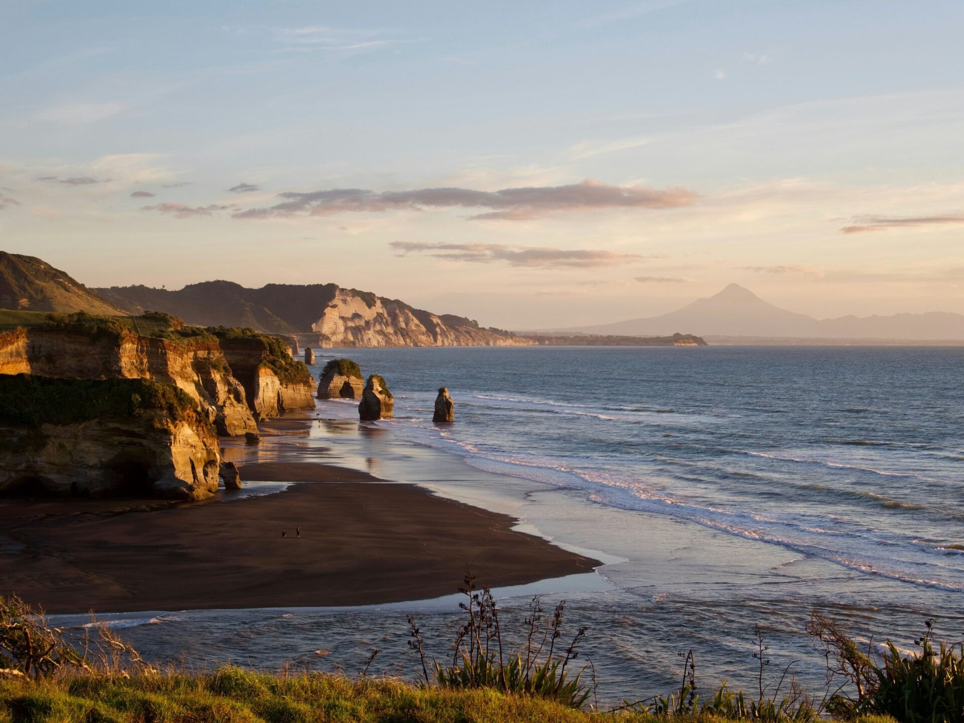 the tree sisters and mount taranaki in the background