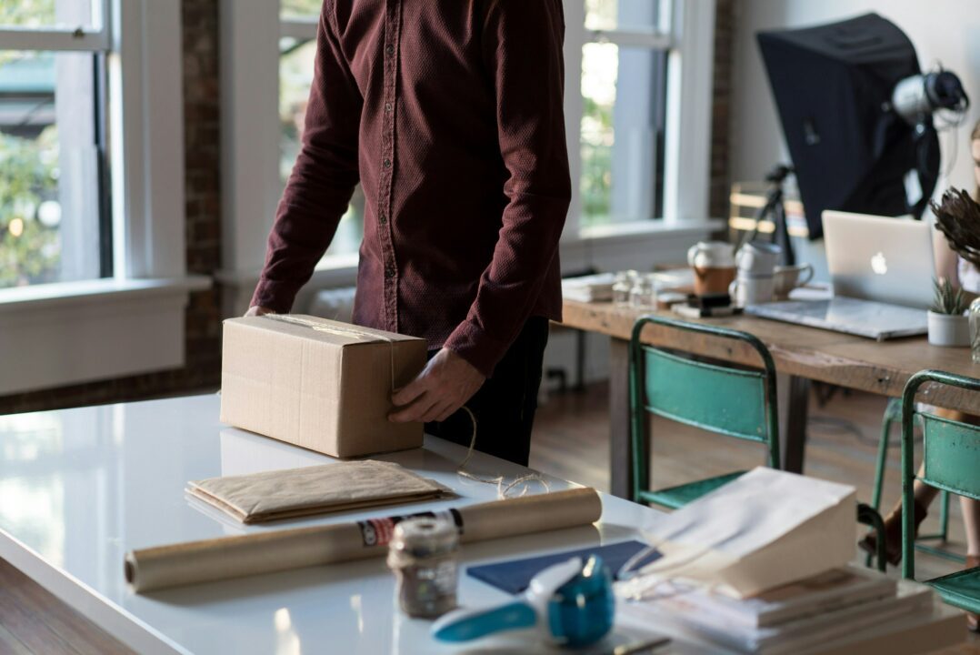 person packing a parcel