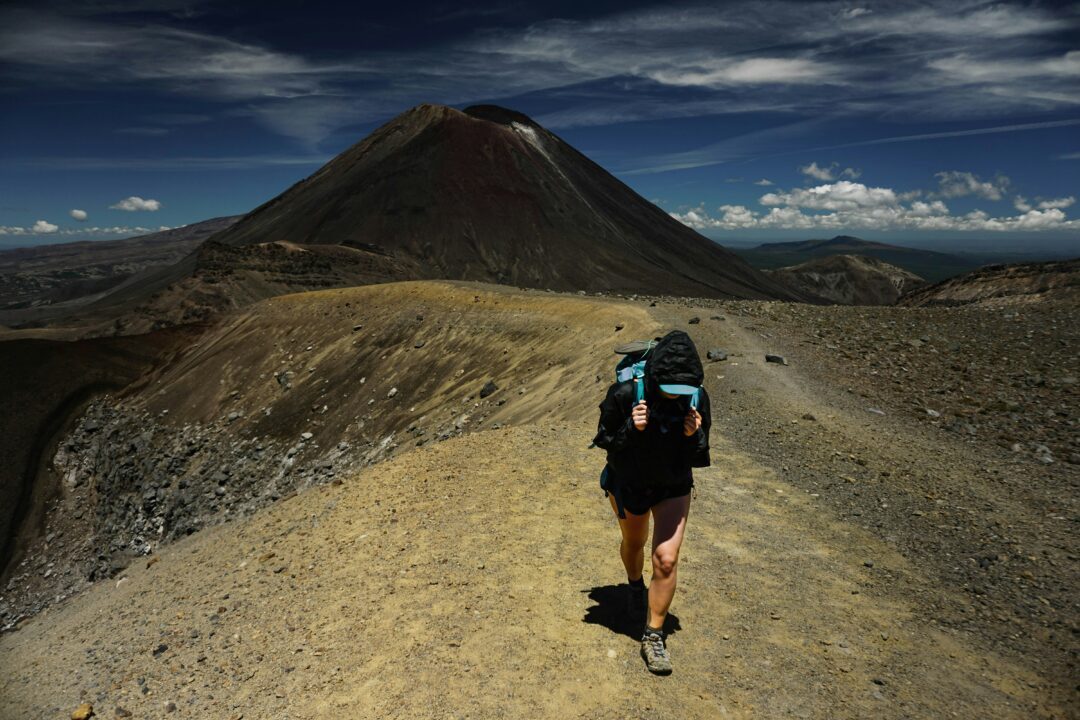 person hiking on tongariro crossing track